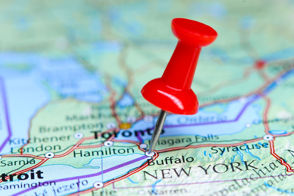 Map of New York and southern Ontario with a red push pin in Buffalo. 