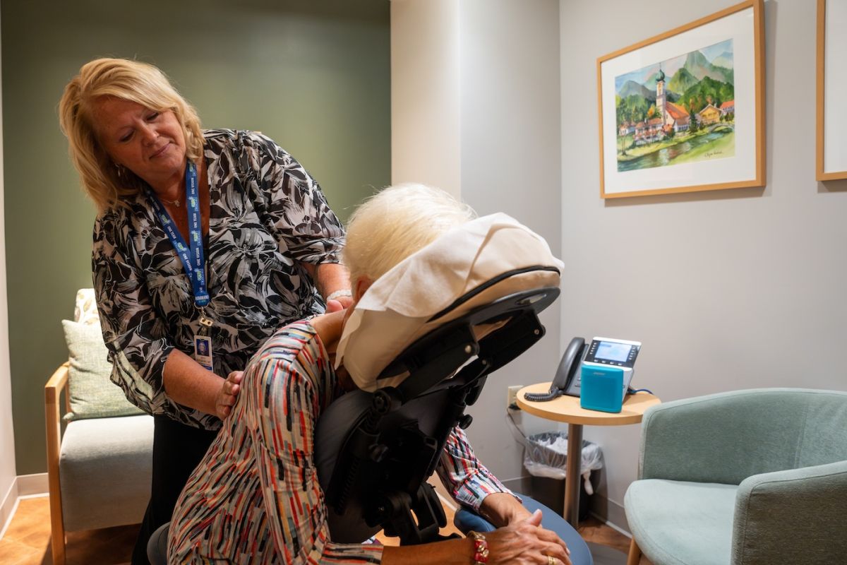 Oncology massage therapist Beth Bergmann, performs a massage on a patient in the 11 Day Power Play Cancer Resource Center