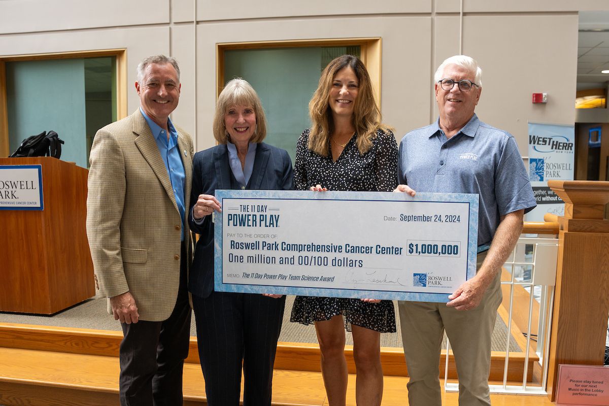 The 11 Day Power Play team presenting a $1 million check to Roswell Park.