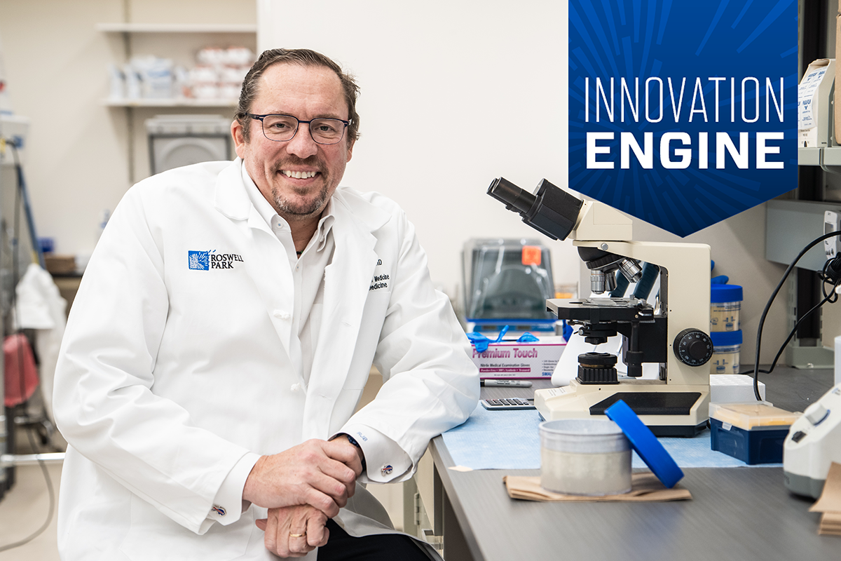 Renier Brentjens, MD, smiles at the camera in a lab with an Innovation Engine badge