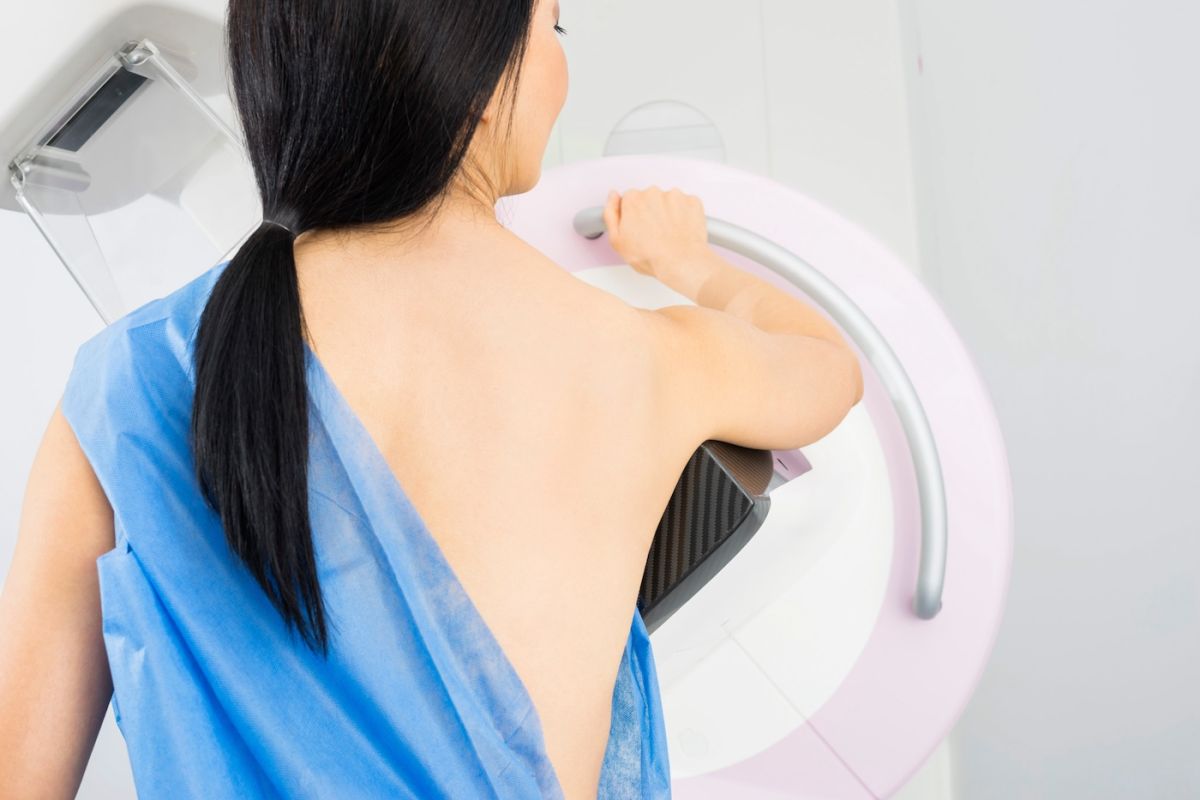 A woman of Asian decent has a mammogram