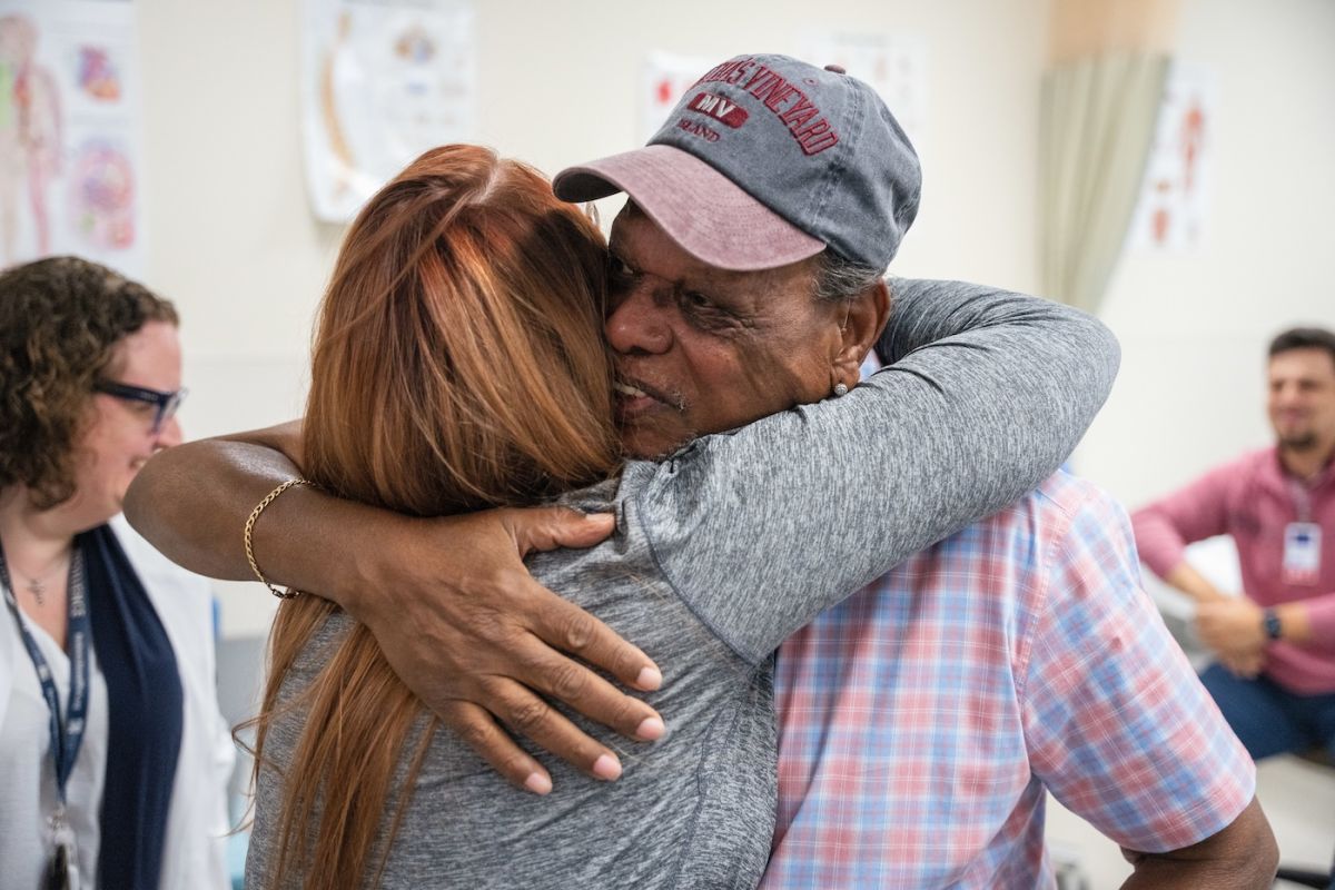 Man hugging a woman