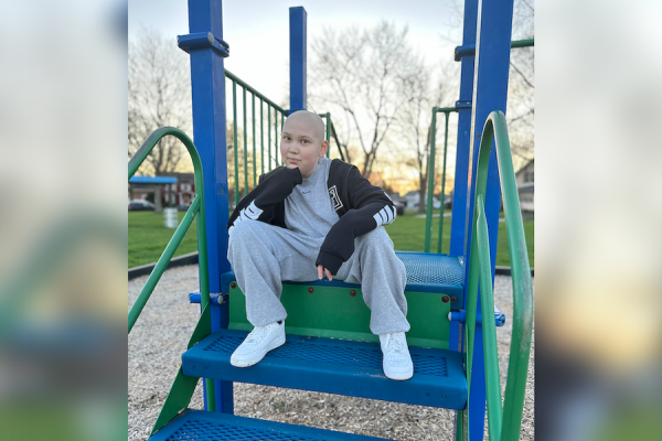 Pediatric patient and 2024 Tree of Hope lighter Willow McMurray poses on a playground