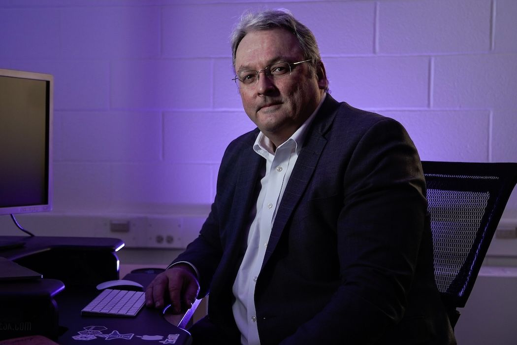 Man sitting in front of a computer