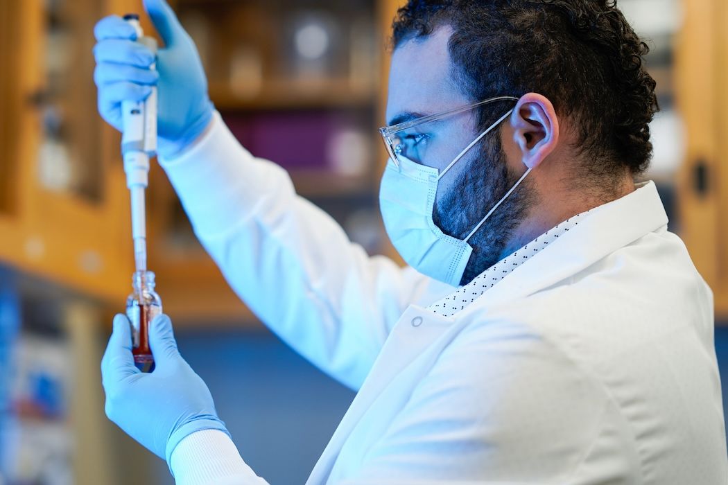 Man filling a test tube